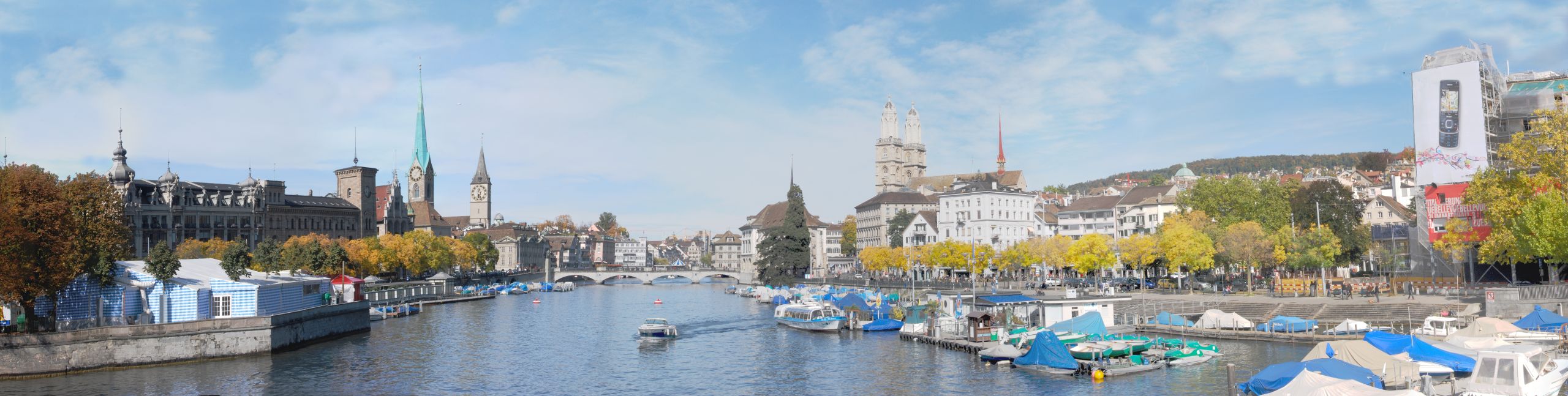 Panorama Zürichs von der Quaibrücke. Neben dem Bauschänzli stand früher, mitten in der Limmat, der Wellenbergturm © Micha L. Rieser, https://commons.wikimedia.org/w/index.php?curid=4930649